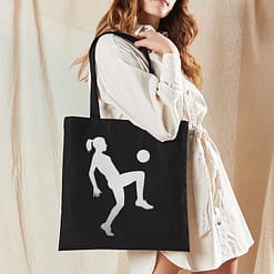 Girl Playing Football tote bag